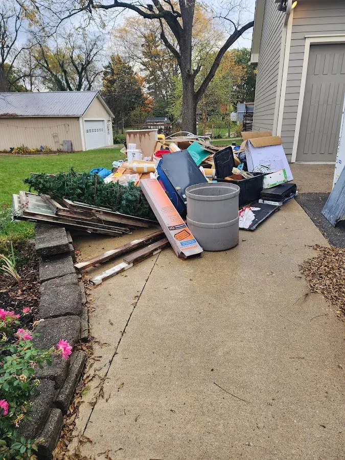 Dumpster being loaded with debris for Estate Cleanout Dumpster Rental in Crouch Mesa